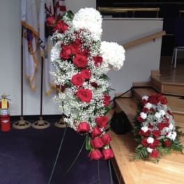 Standing cross with roses and carnations