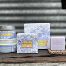 Lavender chamomile scented soap, candle, and body butter products on a shelf