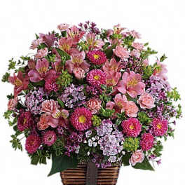 Basket arrangement of pink and purple flowers
