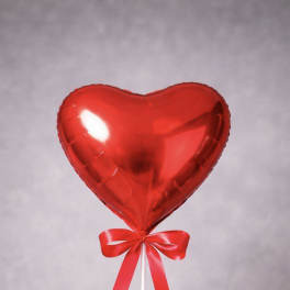 Red heart-shaped balloon with a red ribbon bow