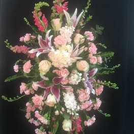 Tall pink and white floral standing spray with lilies and roses