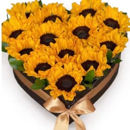 Heart-shaped bouquet of sunflowers with a satin bow