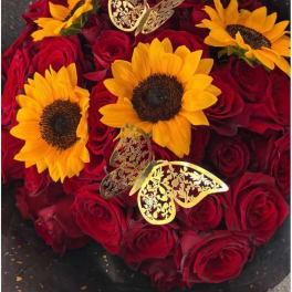 Red roses with yellow sunflowers and gold butterfly decorations
