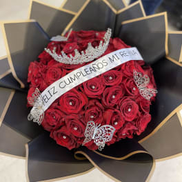 Red rose bouquet with a crown and birthday sash