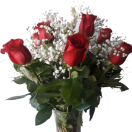 Red roses with white baby's breath in a clear glass vase