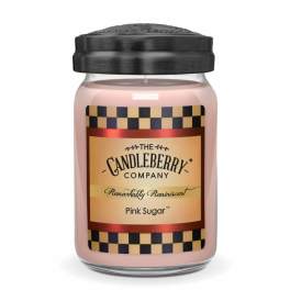 Pink candle in a glass jar with a black lid and labeled front