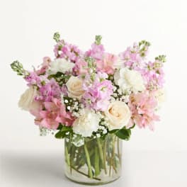 Pink and white mixed bouquet in a clear glass vase
