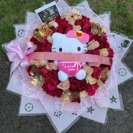 Bouquet of red and blush roses with a Hello Kitty plush and pink ribbon