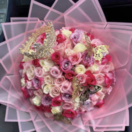 Pink rose bouquet with butterfly decorations and sheer wrapping