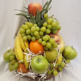 Fruit basket with grapes, bananas, apples, oranges, and pears