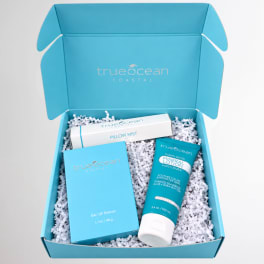 Blue gift box with perfume, pillow mist, and lotion