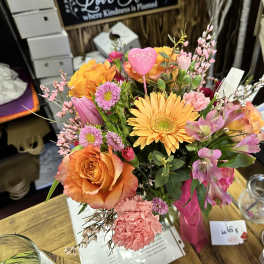 Colorful mixed bouquet with orange roses and yellow gerbera daisies