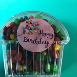 Clear candy container with a "Happy Birthday" label