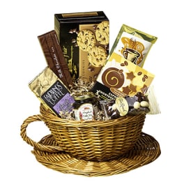 Wicker basket filled with assorted chocolates and cookies