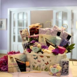 Gift basket with bath products, soaps, and purple flowers