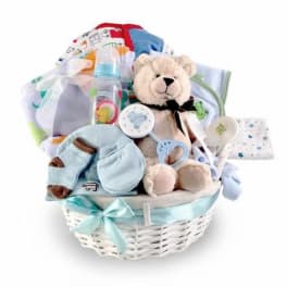 Baby gift basket with teddy bear, blanket, bottle, and socks