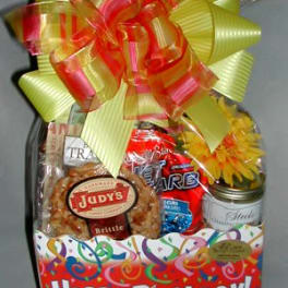 Birthday gift basket with snacks and a large ribbon bow