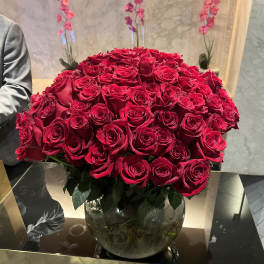 Large bouquet of red roses in a glass vase