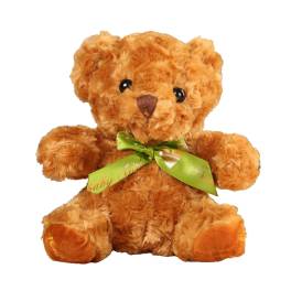 Brown teddy bear with a green ribbon bow
