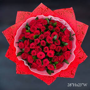 Large bouquet of red roses wrapped in decorative red paper