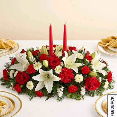 Red and white floral centerpiece with two red candles