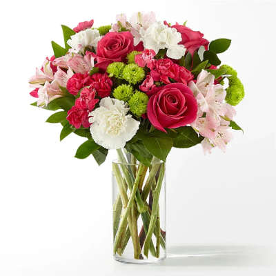 Pink and white mixed bouquet in a clear glass vase