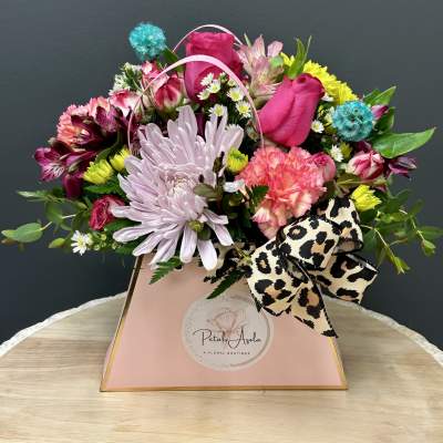 Mixed bouquet in a pink gift box with a leopard-print bow