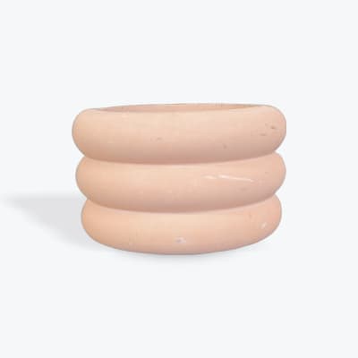 Stacked peach ceramic planter with a rounded ribbed shape