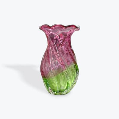 Pink and green glass vase with a flared rim