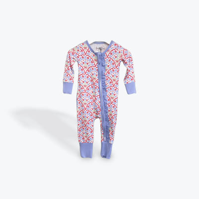 Floral-patterned baby sleeper with lavender trim and ruffles