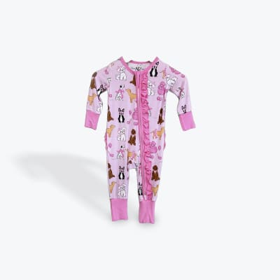 Pink baby onesie with dog prints and ruffled zipper trim
