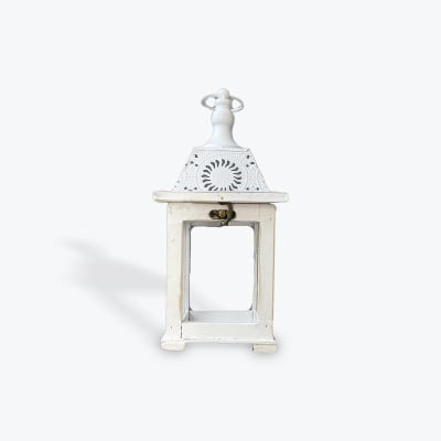 White decorative lantern with a metal top and open frame