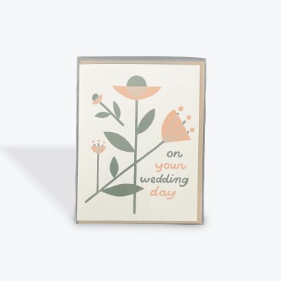Wedding card with stylized flowers and the words "on your wedding day"