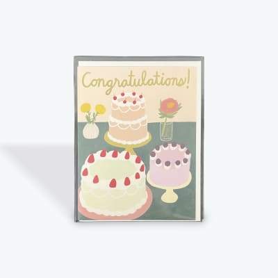 Greeting card with cakes and flowers and the word Congratulations