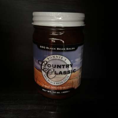 Jar of BBQ black bean salsa with a white lid