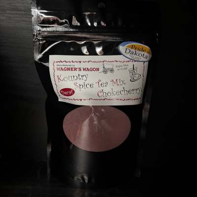 Black pouch of Kountry Spice Tea Mix with a label and circular window