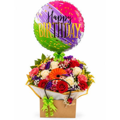 Birthday balloon above a mixed rose bouquet in a gift bag