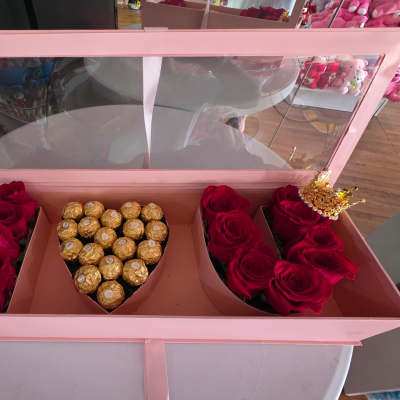 Pink gift box with red roses and Ferrero Rocher chocolates