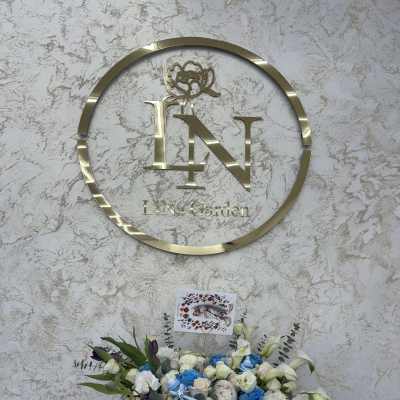 Blue and white rose arrangement with lilies and a teddy bear in a box