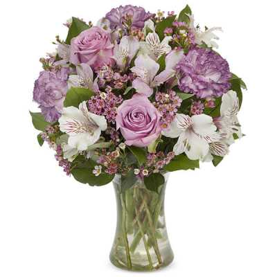 Pink and white mixed bouquet in a clear glass vase