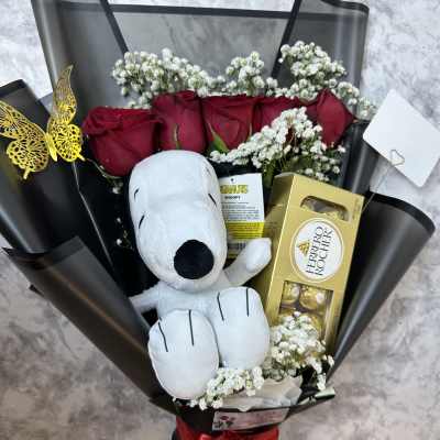 Elegant rose bouquet with a plush toy.