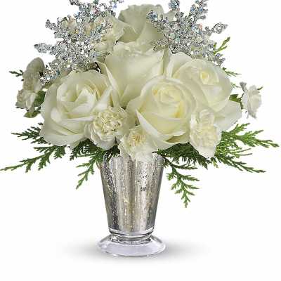 White roses in a silver vase with glittery accents