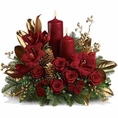 Red roses arranged with two red candles and gold accents