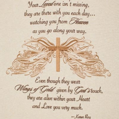 Memorial plaque with the words "Wings Of Gold" and a winged design