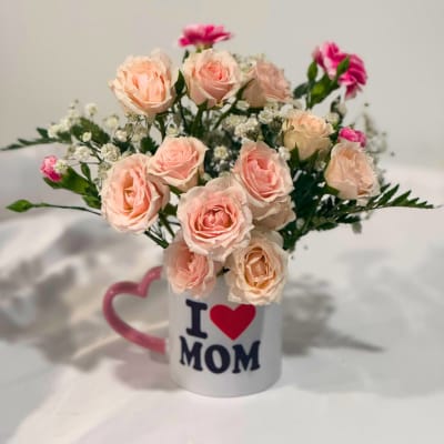 Pink roses in a mug that says I love Mom