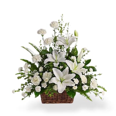 White lilies and carnations in a wicker basket