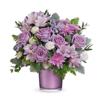 Lavender bouquet in a purple glass vase