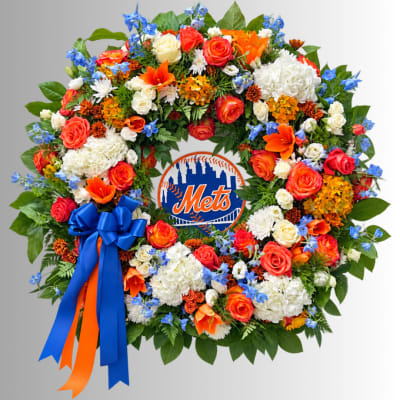 Circular floral wreath with a Mets logo in the center and a blue ribbon bow
