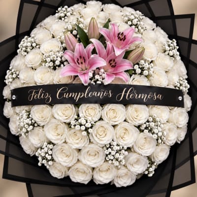 White rose and pink lily bouquet with a birthday ribbon