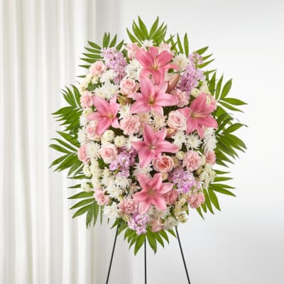 Pink and white floral standing spray on an easel
